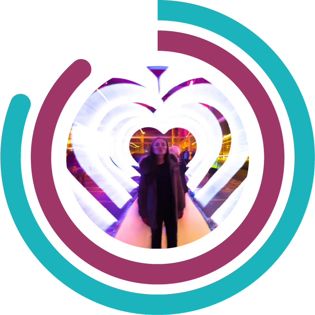 Lady stood in centre of heart structures